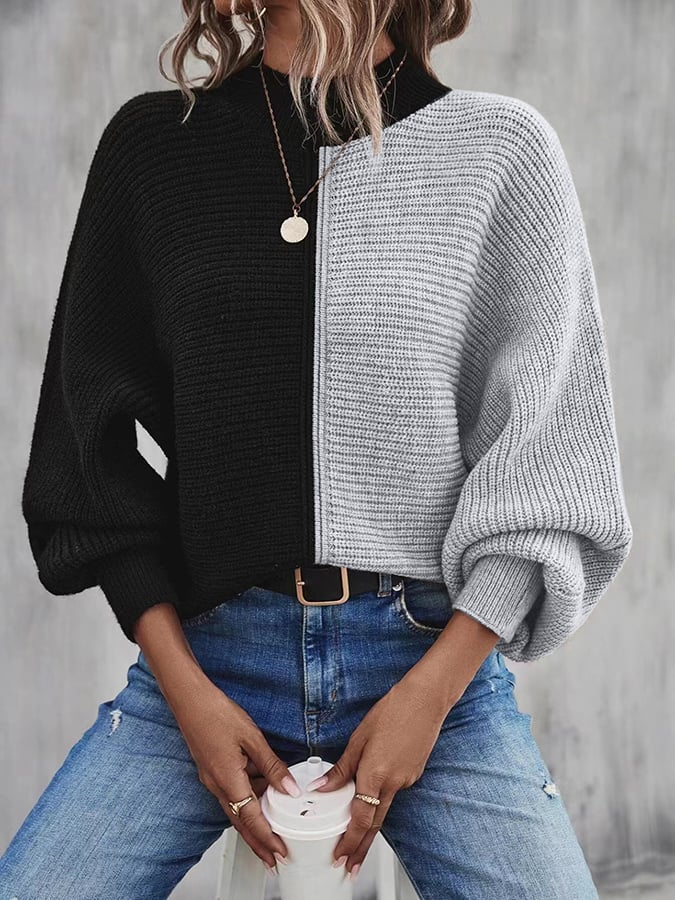 Modieuze pullover met vleermuismouwen en contrasterende inzetstukken