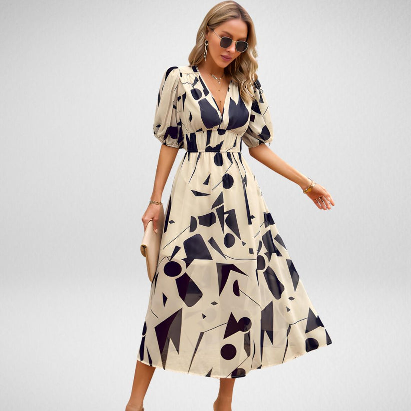 Chique midi jurk met geometrisch patroon en korte mouwen in lanternstijl