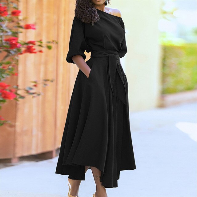 Trendy en elegante midi-jurk met mouwen tot de elleboog en verstelbare tailleband