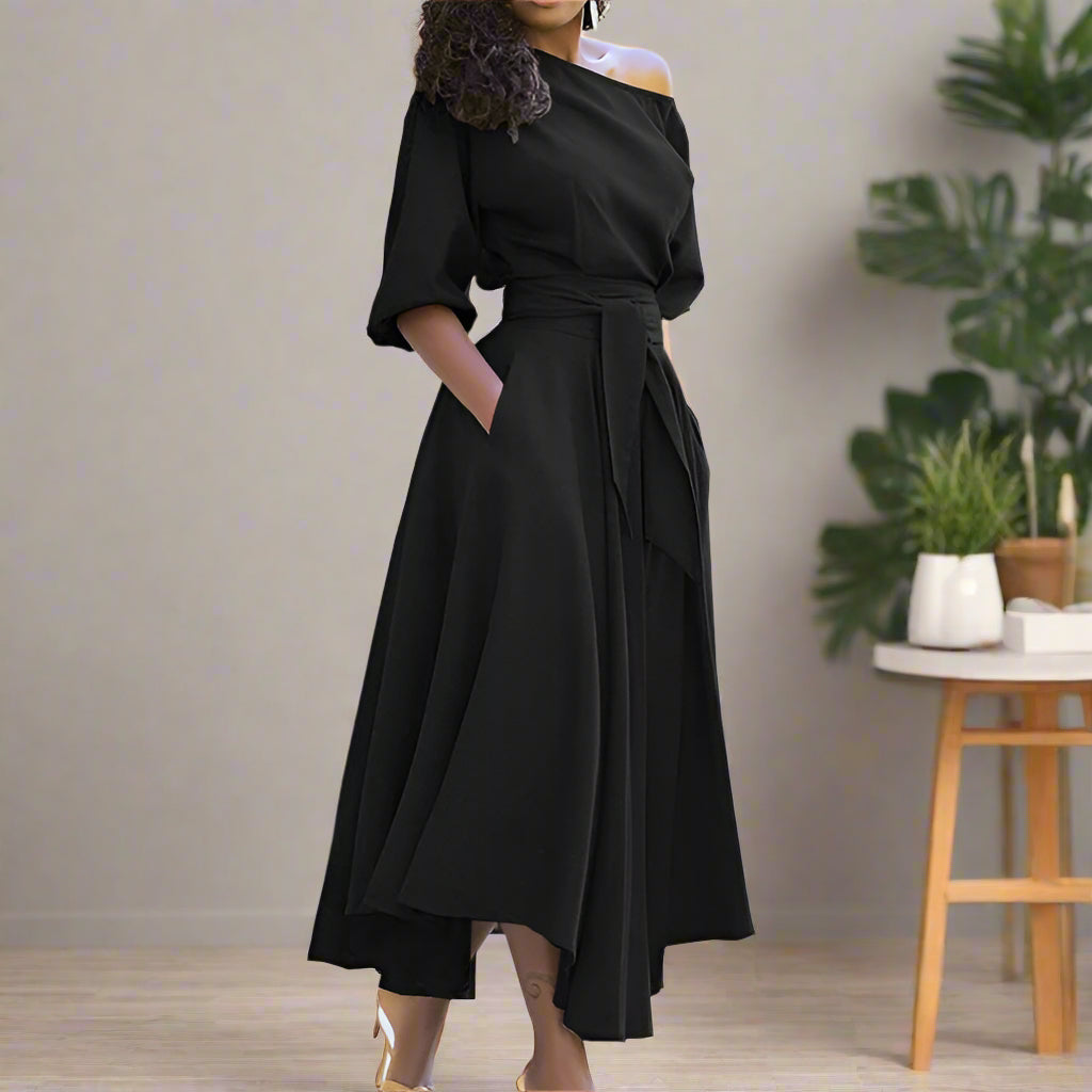 Trendy en elegante midi-jurk met mouwen tot de elleboog en verstelbare tailleband