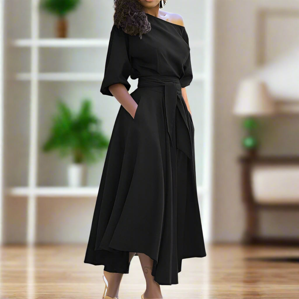 Trendy en elegante midi-jurk met mouwen tot de elleboog en verstelbare tailleband