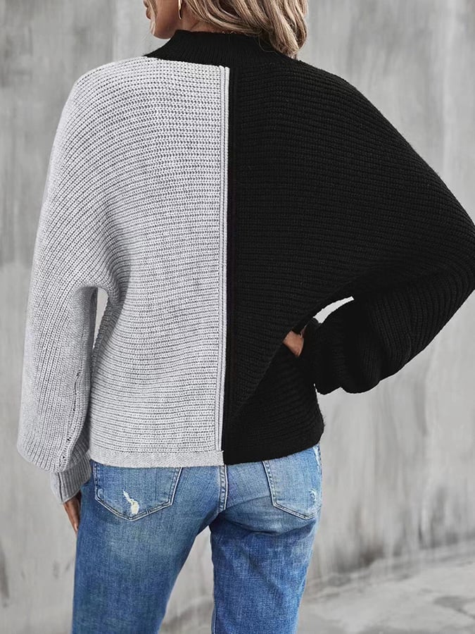 Modieuze pullover met vleermuismouwen en contrasterende inzetstukken