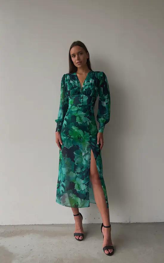 Chique lange jurk met split, bloemendetails en lange volumineuze mouwen