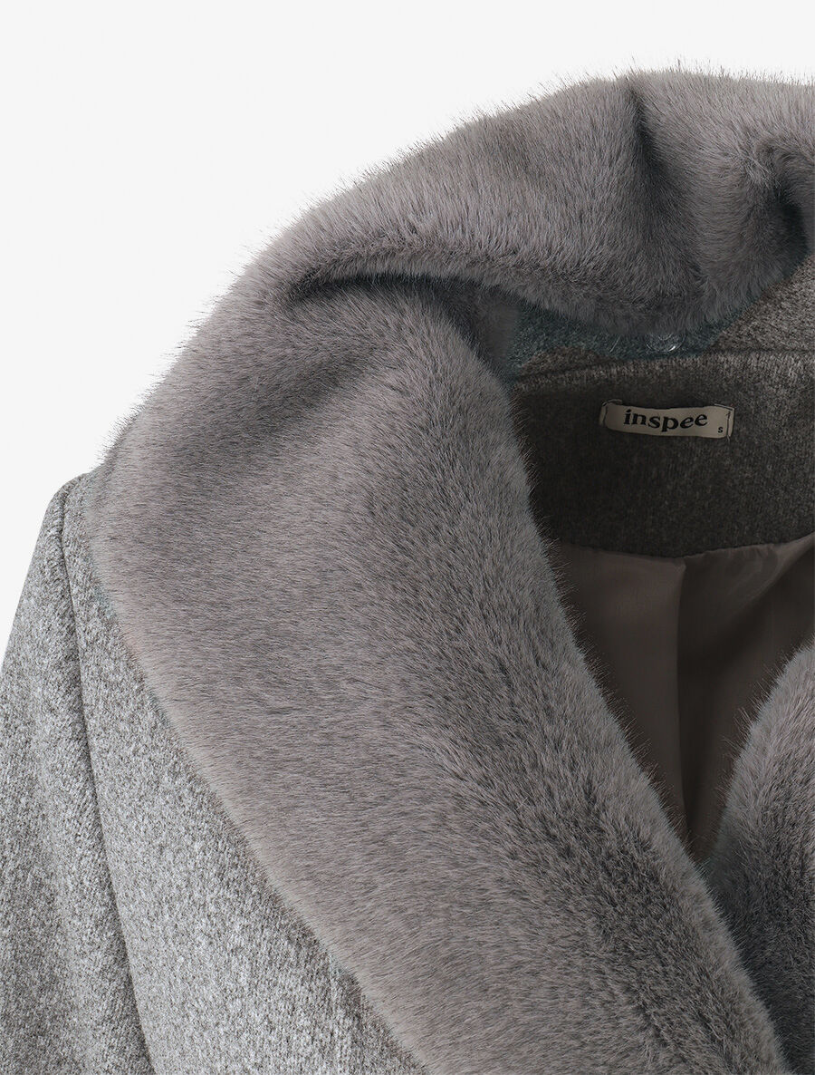 Elegante damesjas in monochroom ontwerp met unieke kraag