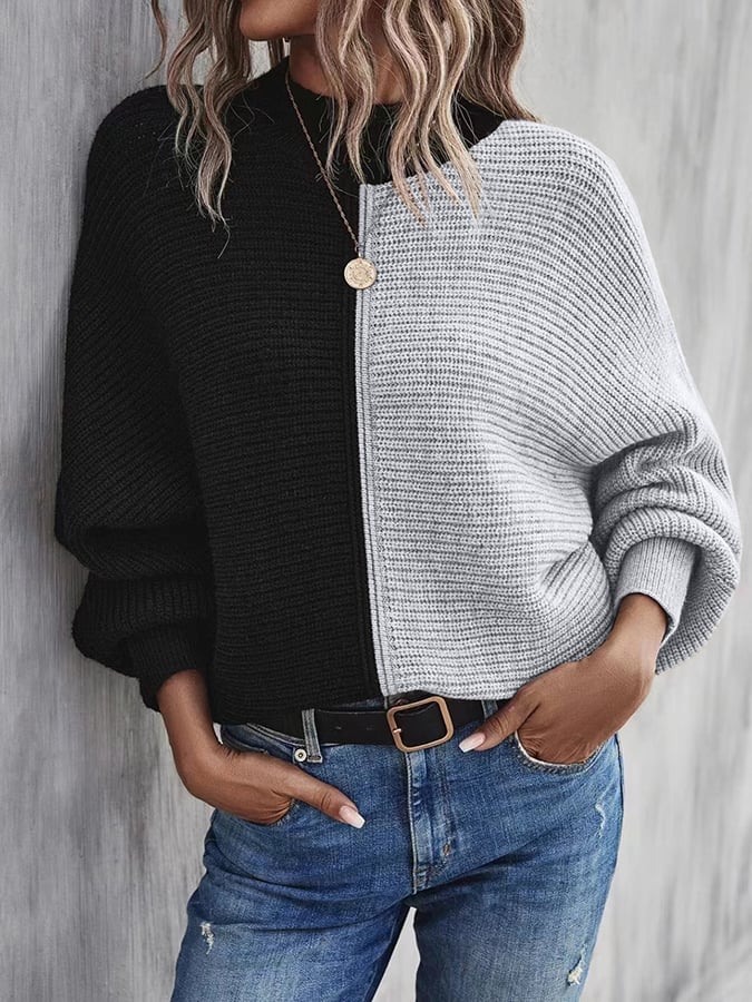 Modieuze pullover met vleermuismouwen en contrasterende inzetstukken