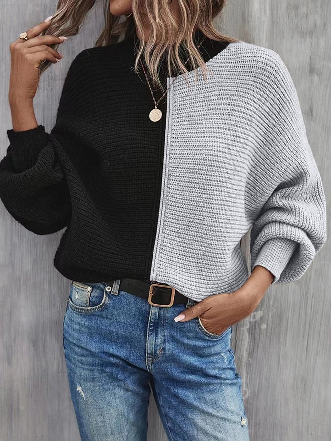 Modieuze pullover met vleermuismouwen en contrasterende inzetstukken