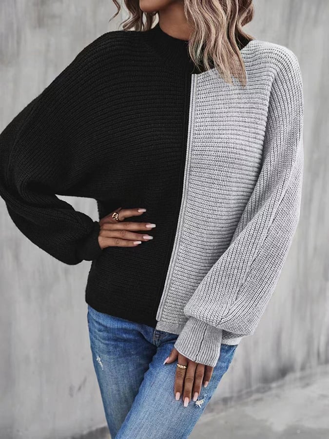 Modieuze pullover met vleermuismouwen en contrasterende inzetstukken