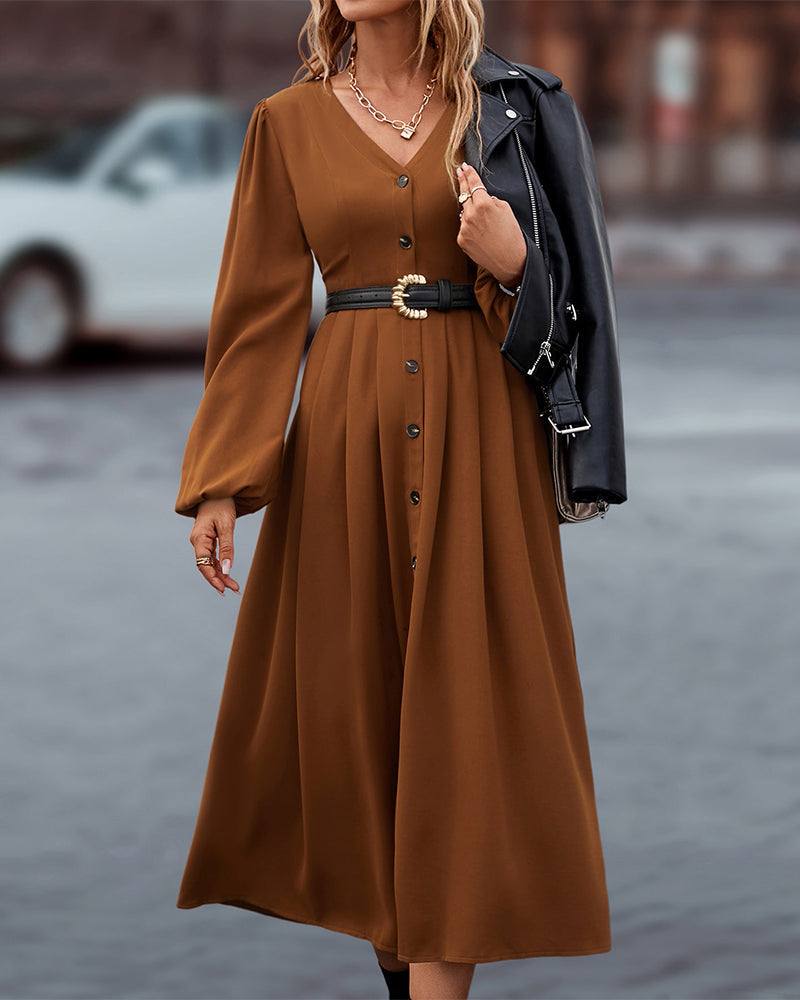 Midi-jurk met elegante knopen en lange pofmouwen, een must-have voor elke garderobe