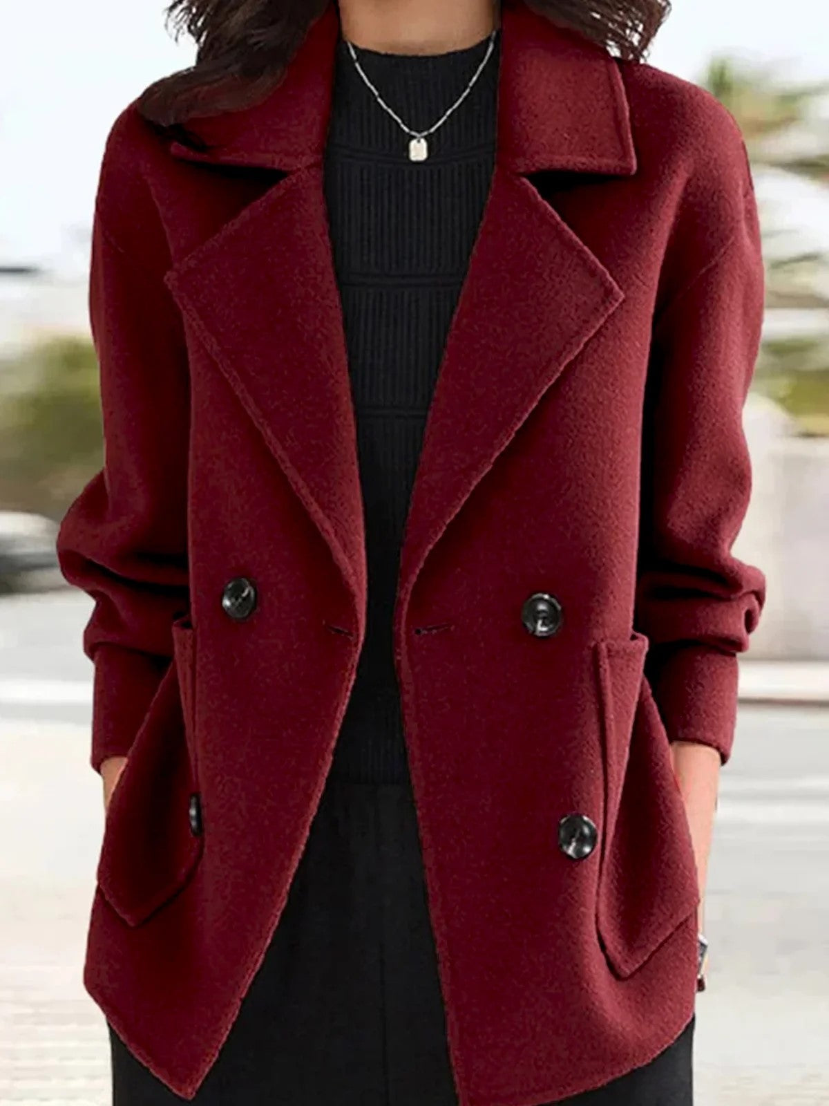 hippe blazer met minimalistische kraag, knopen en zakken